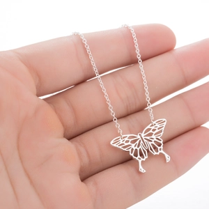 Detailed view of a silver butterfly pendant necklace with elegant hollow-out wings design