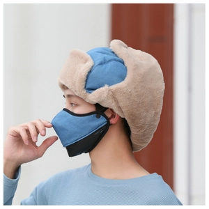 Detail of blue winter trapper hat with beige faux fur lining and matching face mask
