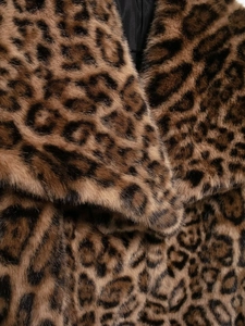 Detailed close-up of premium leopard print faux fur texture and collar on a short jacket