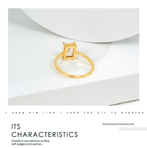 Macro shot of minimalist gold ring featuring a sparkling rectangular cubic zirconia stone