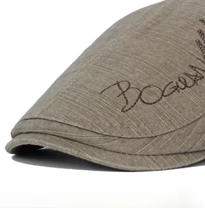 Close-up of khaki newsboy cap with vintage embroidery and durable stitching detail