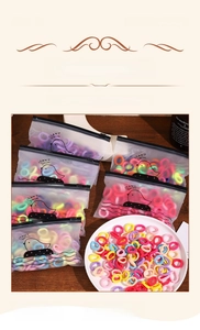 Close-up of colorful elastic hair bands in translucent zip bags for children