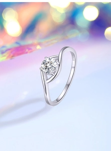 Macro shot of 0.5ct moissanite ring with S925 engraved twisted band and four-prong setting