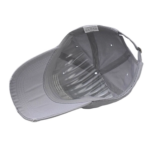 Detailed view of the 100% cotton inner lining and adjustable strap on gray baseball cap