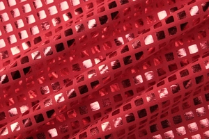 Gros plan d'un tissu rouge à carreaux métalliques avec feuille dorée et texture plissée