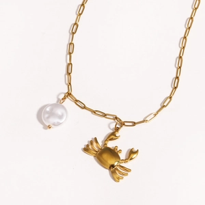 Golden titanium steel necklace with starfish and white pearl charms on white background