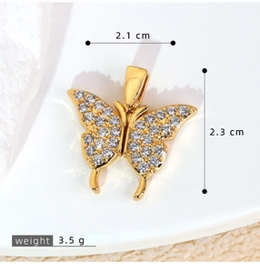 Detailed view of gold butterfly pendant with micro-pave cubic zirconia and dimensions