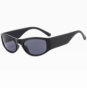 Close-up of modern retro black oval sunglasses with wide temples and dark gray lenses