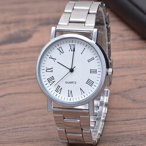 Classic silver quartz watch with white Roman numeral dial on dark wooden background