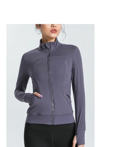 Detail view of mauve yoga jacket with thumbholes and breathable side zip pockets