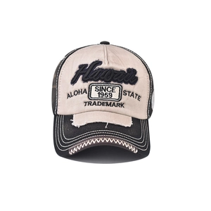 Close-up of vintage Hawaii embroidery and distressed patch details on cotton baseball cap
