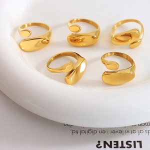 Minimalist 18k gold plated stainless steel irregular open rings in a ceramic tray