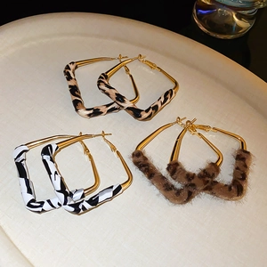 Detailed set of geometric square hoop earrings with leopard print and textured leather finishes