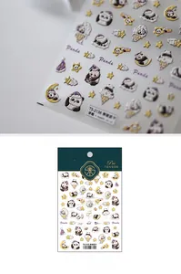 Macro view of 3D embossed panda nail stickers with textured metallic details TS-2135