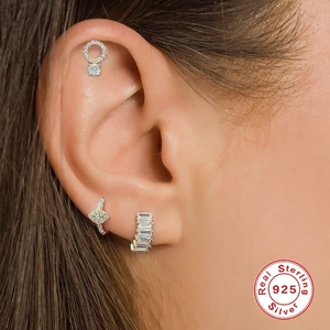 Detailed close-up of 925 sterling silver earring set with sparkling zircon stones
