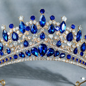 Detail of baroque crown showing gold plating and deep blue pear-cut crystal settings