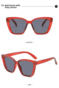 Detail view of red cat eye sunglasses with grey lenses and hollowed-out frame legs