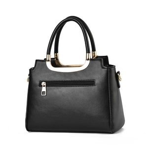 Classic black leather handbag with gold zipper detail and sturdy handles on white background