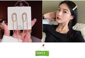 Detailed view of silver tassel earrings with S925 needles and shimmering rhinestones