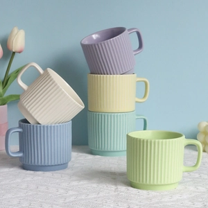 Stackable macaron ceramic mugs with vertical stripes in multiple pastel colors