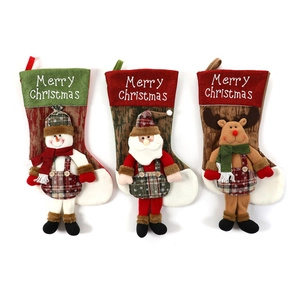 Three oversized Christmas stockings with 3D Santa, Snowman and Reindeer plush figures
