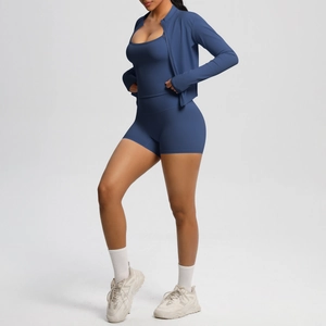 Three-piece navy blue yoga set featuring a zip jacket, tank top, and high-waist shorts