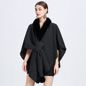 Dark gray knitted poncho cape with thick black faux fur collar and open front design