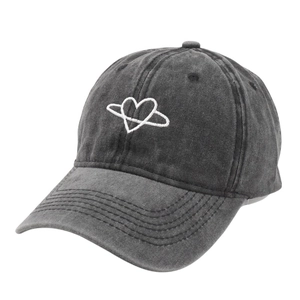 Washed dark grey baseball cap with white heart planet embroidery on a plain white background