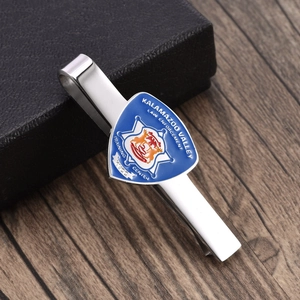 Silver polished tie clip with blue law enforcement emblem on a business gift box