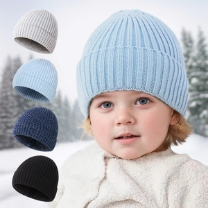 Knitted baby winter hat with ear flaps in various solid colors shown in outdoor snow scene
