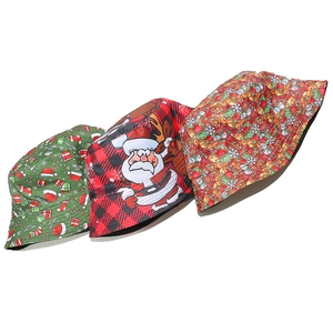 Detailed view of Christmas bucket hats featuring Santa, reindeer, and snowflake patterns