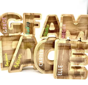 Detail of wooden letter money banks with acrylic covers and personalized name prints