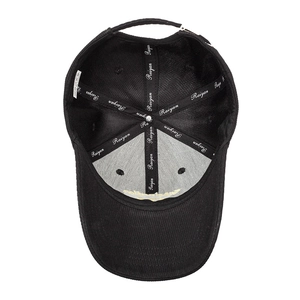 Internal view of black corduroy baseball cap showing Raiyan stitching and embroidery