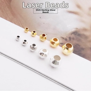 Macro shot of S925 sterling silver faceted laser beads in various sizes and gold colors