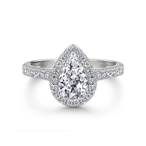 Macro shot of pear-shaped halo engagement ring with micro-paved sparkling cubic zirconia