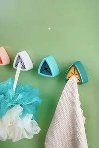 Adhesive towel holder detail with star silicone plug for kitchen and bathroom storage