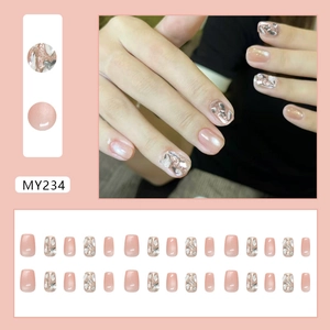 Pink cat-eye press-on nails set with glitter, rhinestones, and irregular gems design