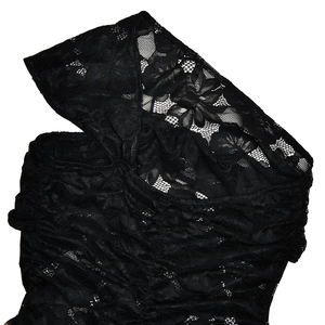 Detailed macro view of black floral lace fabric on a sexy bodycon leopard dress