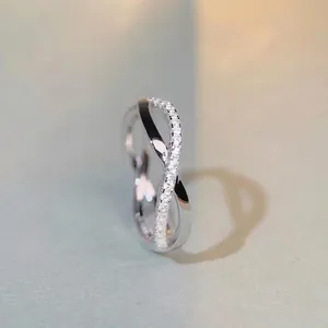 Crossed infinity S925 silver ring with pave-set sparkling cubic zirconia stones