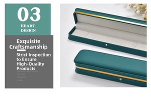 Macro detail of dark green PU leather necklace box with gold rim and velvet lining