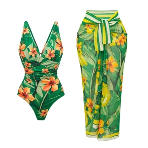 Detail view of tropical green one-piece swimsuit with matching floral sarong set