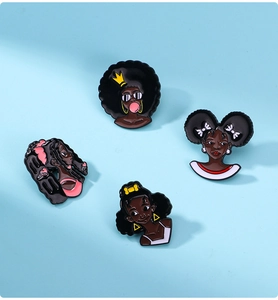 Flat lay of four enamel badges featuring diverse Black women characters on a blue background