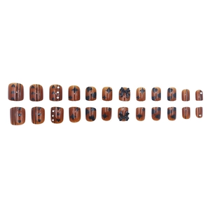 Midnight brown press-on nails set with black 3D bows, hearts and star patterns