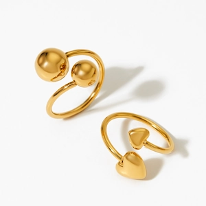 Minimalist gold open ring set featuring heart and ball designs with polished finish