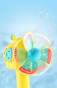Detail of yellow submarine bubble wand with rotating windmill and blue sky background