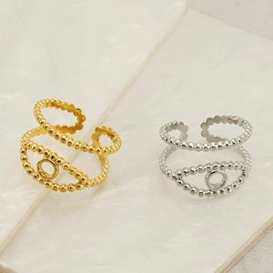 Adjustable titanium steel rings with hollow eye design and beaded edges in gold and silver