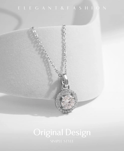 Detail of s925 sterling silver necklace with 1 carat round moissanite pendant on white stand