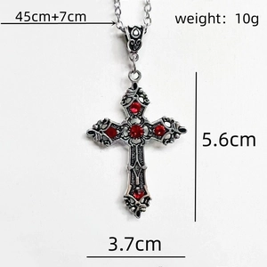 Detailed view of silver cross necklace with red rhinestones and precise size measurements