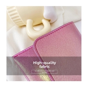 Detail view of pink-purple gradient crossbody bag featuring premium crosshatch leather texture