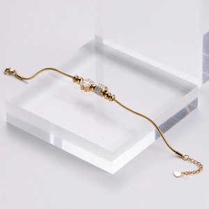 Polished 18k gold plated stainless steel clover charm bracelet with zirconia stones